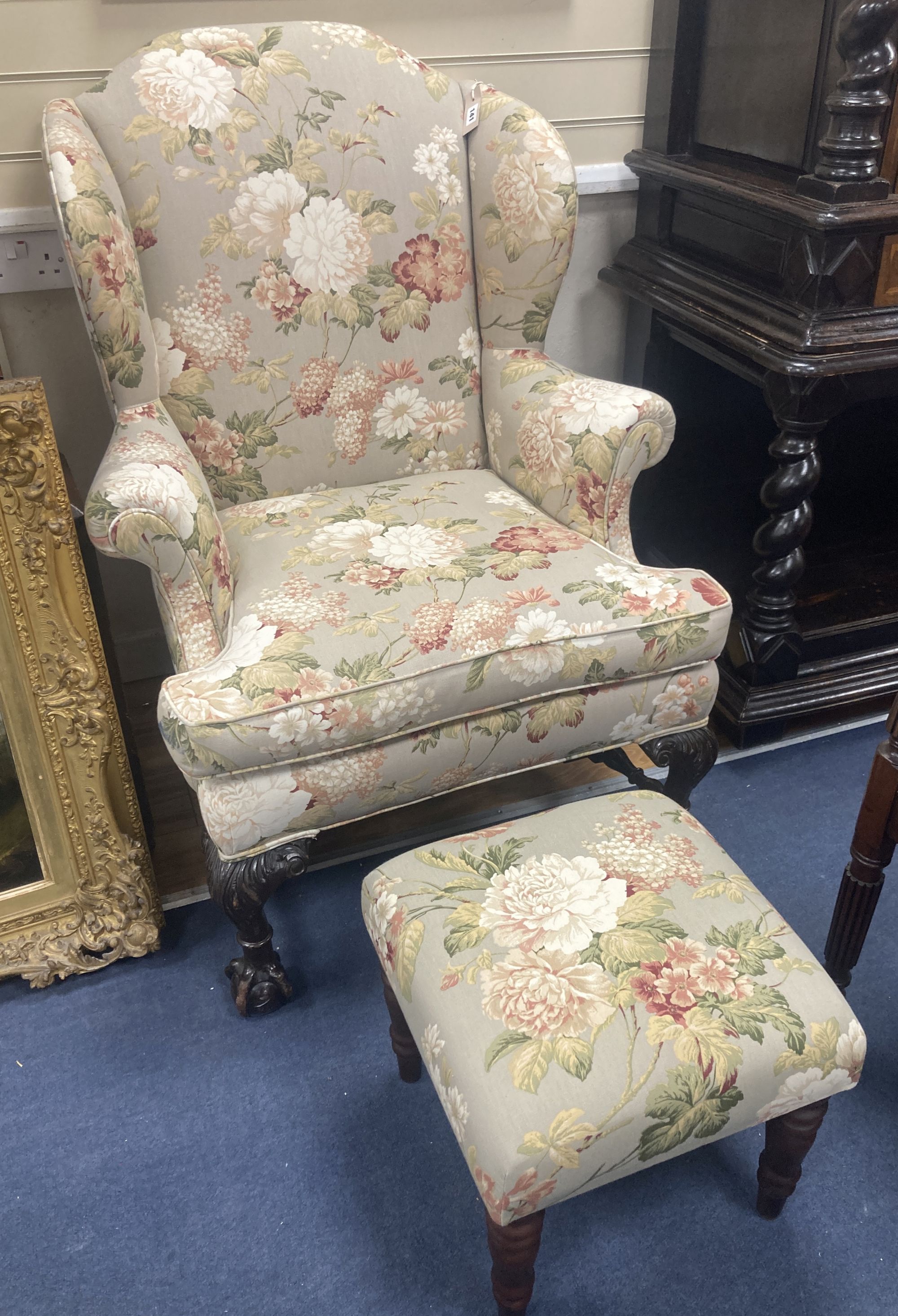 A Chippendale revival wing armchair together with a matching contemporary footstool